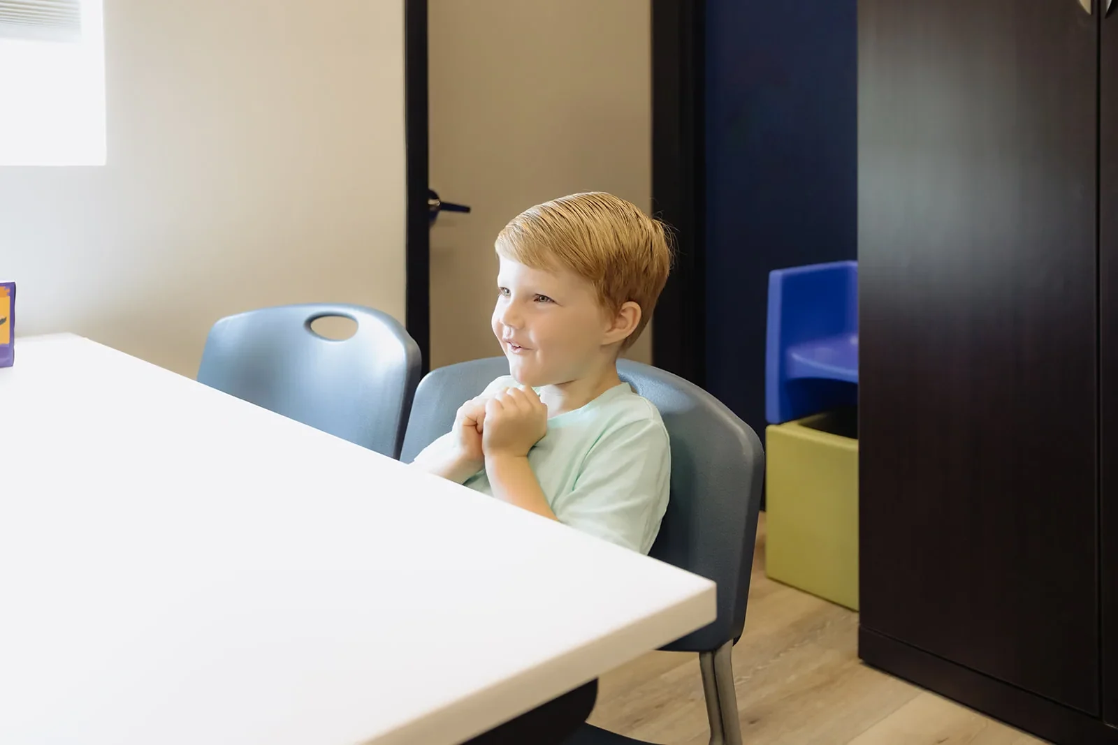 ETLC stuttering therapy for children Young boy working with a speech-language pathologist on stuttering therapy