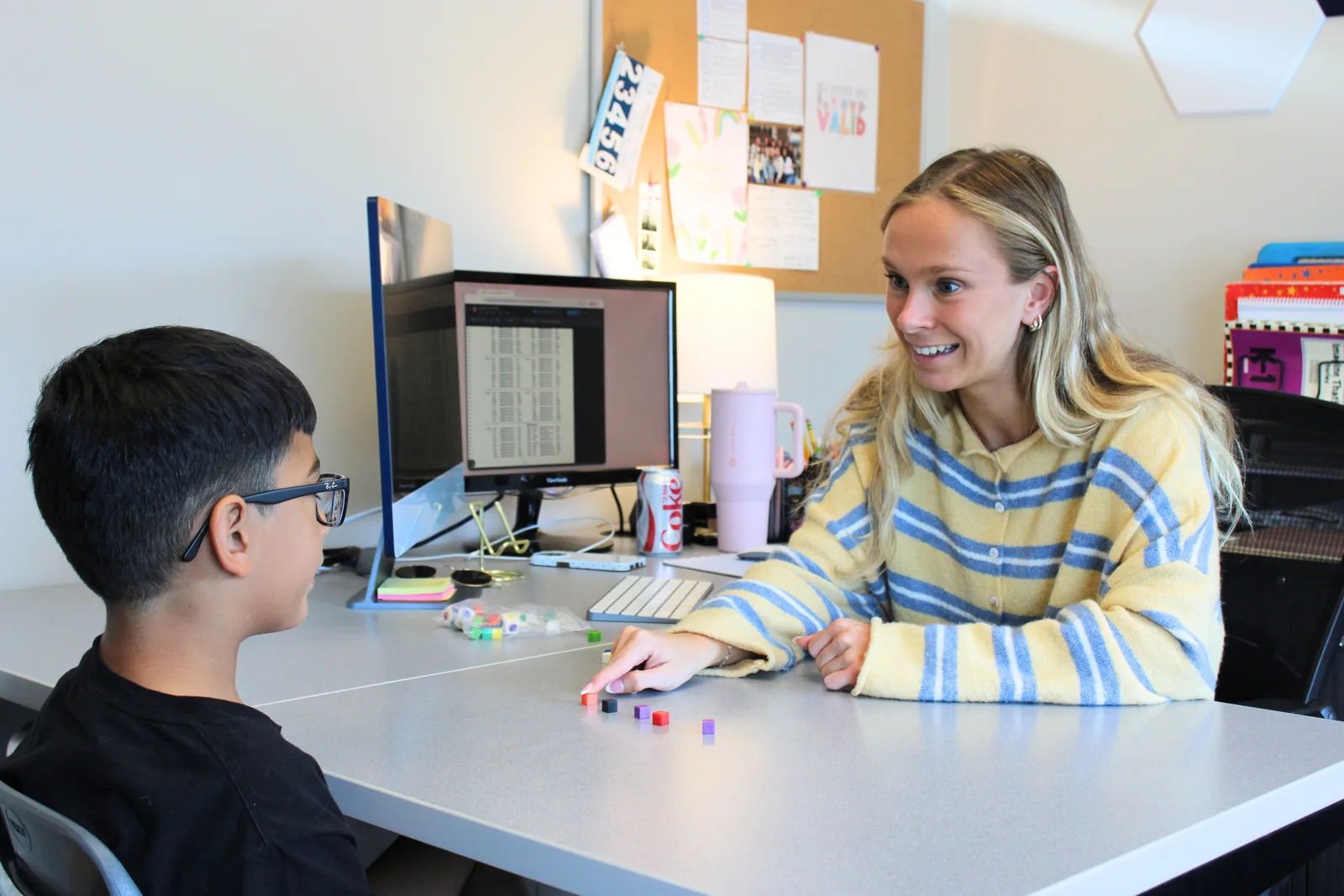 what-is-phonological-awareness-and-why-does-it-matter-for-reading Student using colored sound blocks with an ETLC therapist to practice phonological awareness