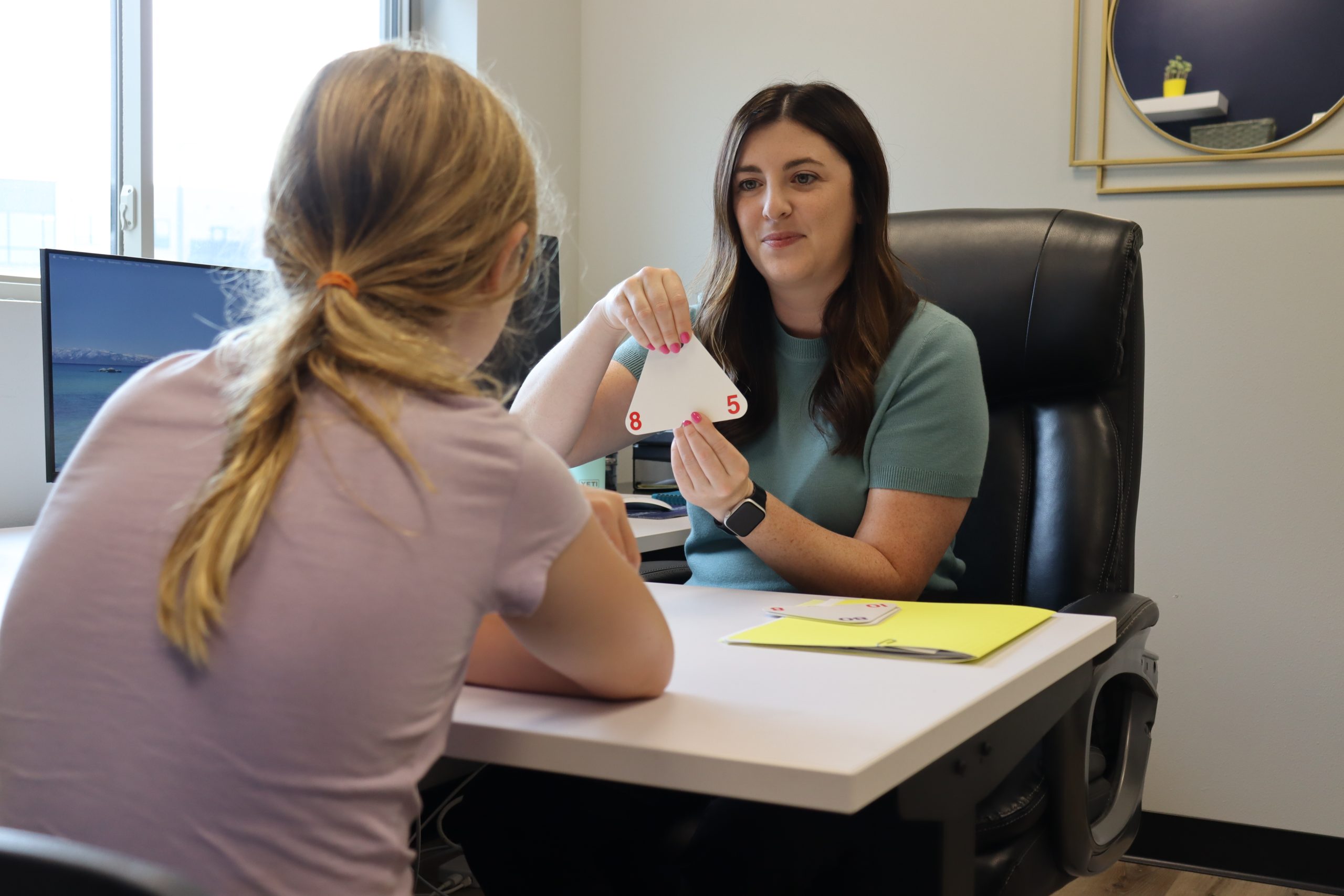 Student practicing math facts with a tutor during a tutoring session