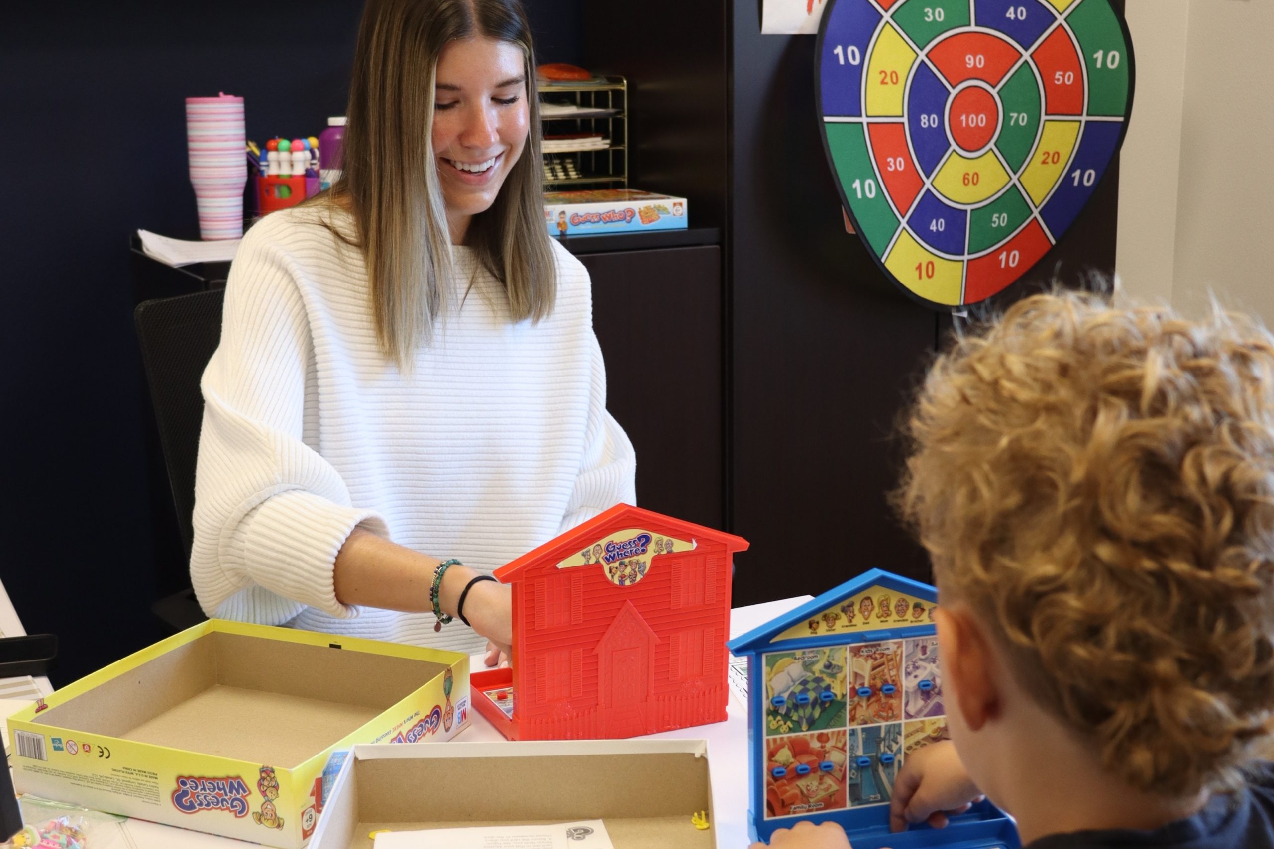 Provider and student playing games for executive functioning together